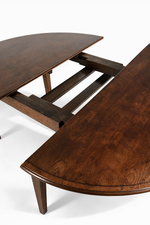 56" Round Extendable Tapered Leg Dining Table