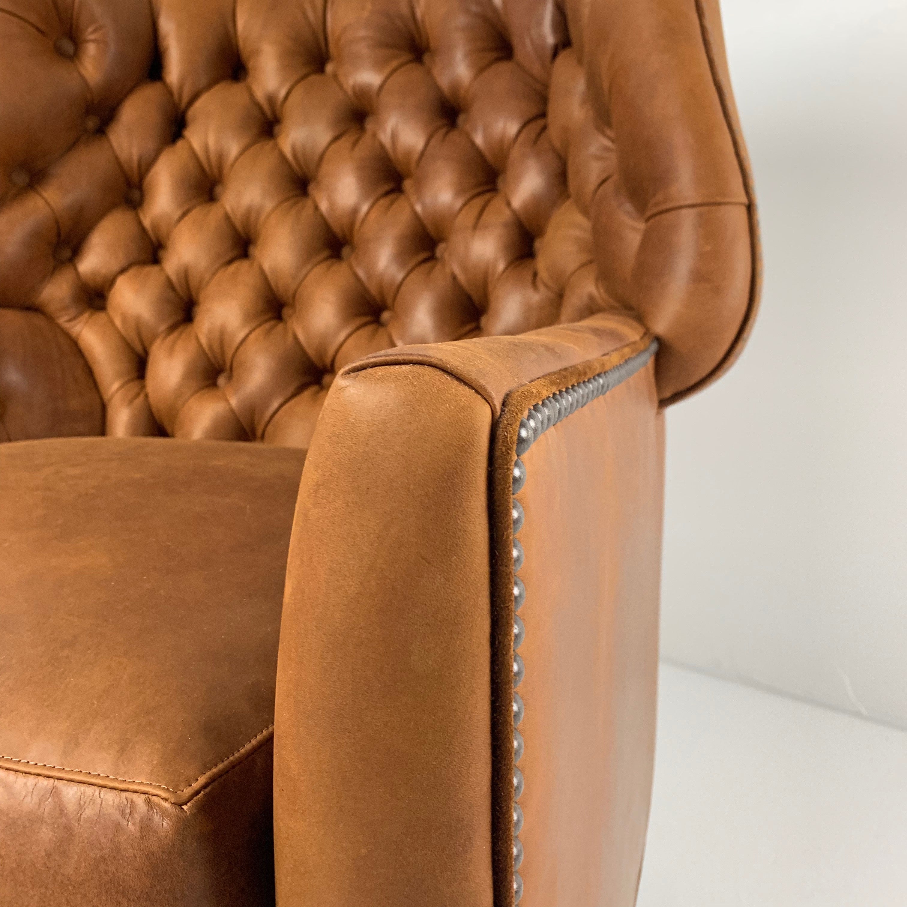 Webster Leather Chair by Wesley Hall shown in Sheridan Nutmeg leather - close up arm